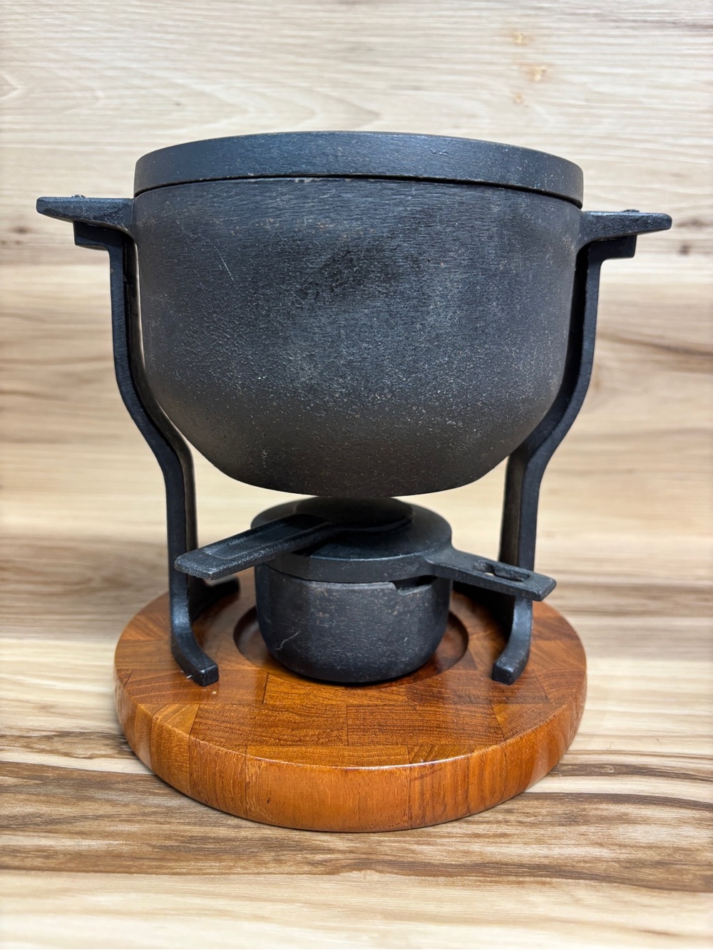 Digsmed Vintage mid-century modern cast iron and teak wood fondue pot.